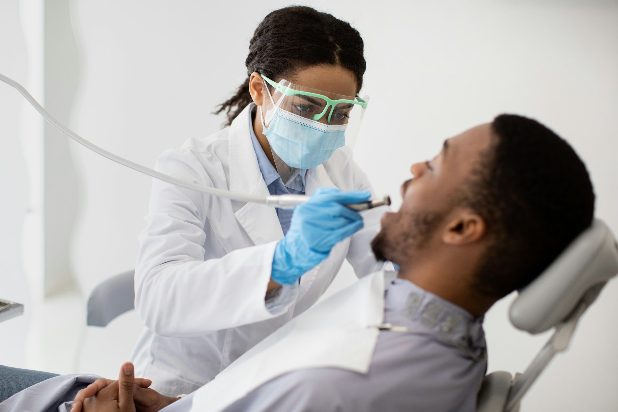 Dentist treating patient